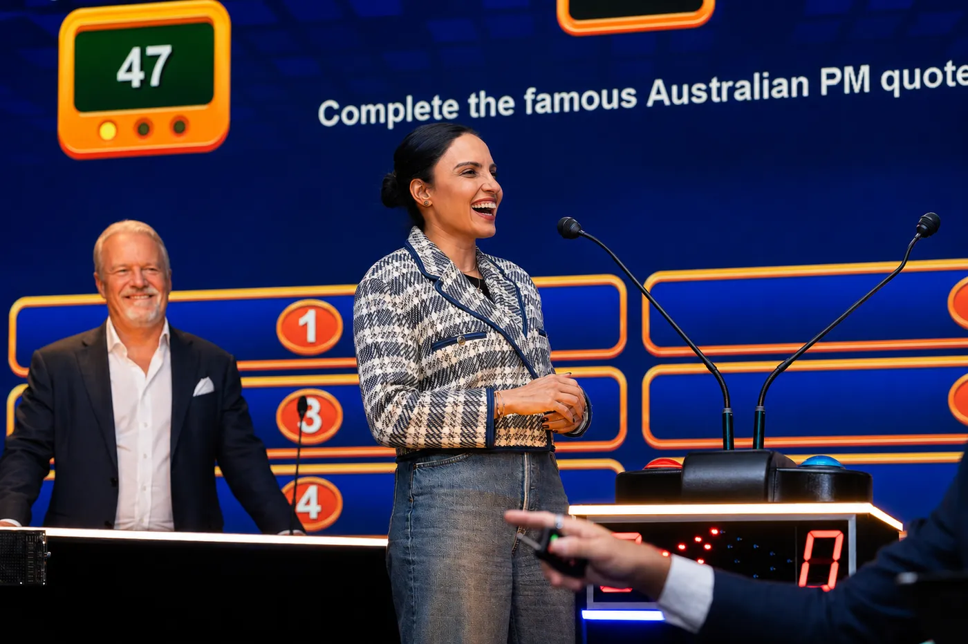 A contestant playing a TV-style corporate game show